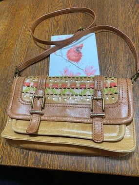 Vintage Thesak crossbody leather punch design. 10X6”